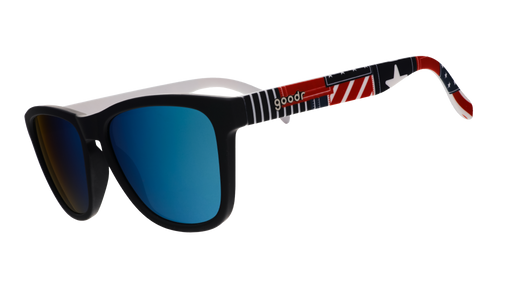 Three-quarter angle view of a pair of red, white, and blue sunglasses with a patchwork design and blue reflective lenses.