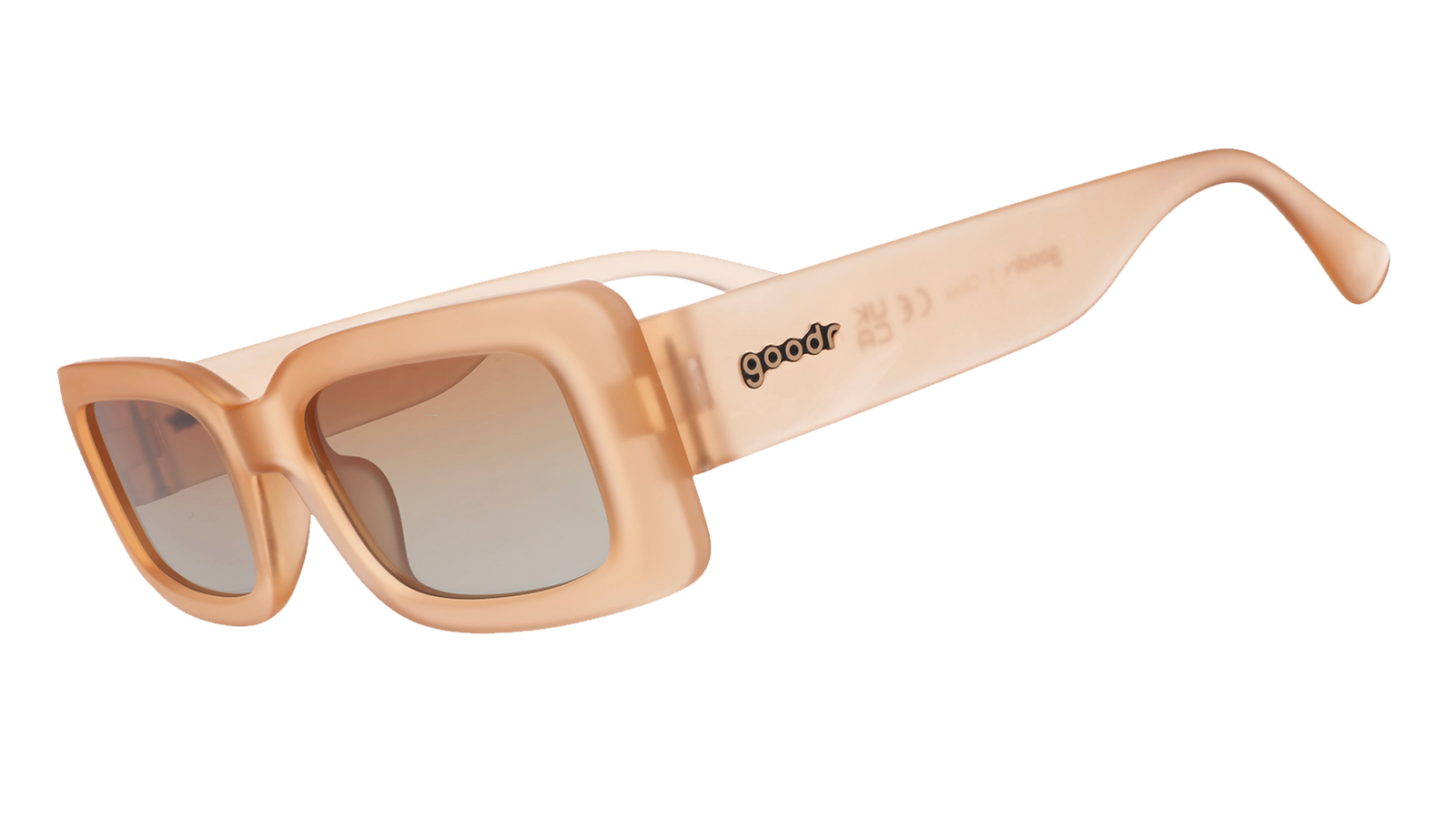 Three-quarter angle view of translucent peach rectangular Luxe G sunglasses with orange-gold gradient lenses. 