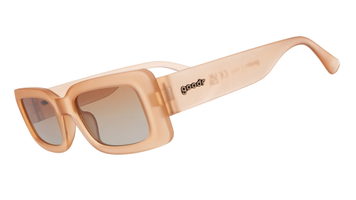 Three-quarter angle view of translucent peach rectangular Luxe G sunglasses with orange-gold gradient lenses. 