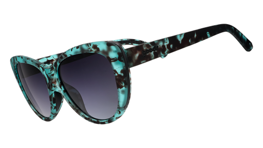 Three-quarter angle view of translucent teal tortoiseshell cat-eye frames featuring black gradient lenses.