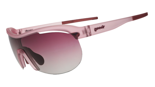 Three-quarter angle view of translucent purple wrap shield sunglasses with gradient purple lenses against a white background.