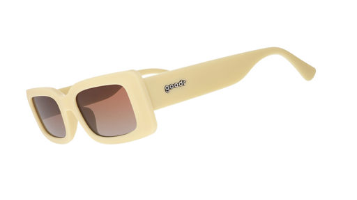 Three-quarter angle view of yellow rectangular sunglasses with brown-tinted polarized lenses against a white background.
