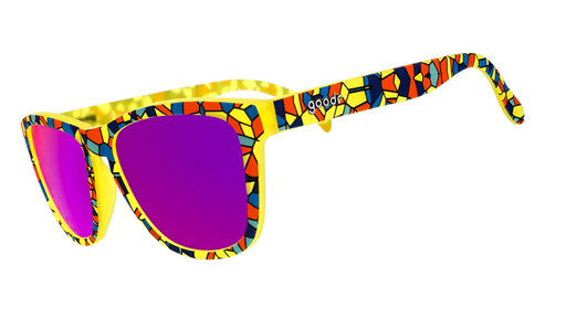 Three-quarter angle view of yellow OGs featuring a vibrant, multi-colored stained glass design w/ rose reflective lenses.