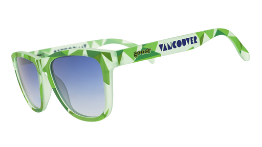 Front view of light green sunglasses w/ a tonal geometric pattern & blue gradient lenses on a white background.