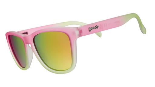 Three-quarter angle view of wayfarer-style pink and green OG sunglasses with reflective pink lenses.