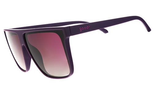 Three-quarter angle view of oversized, dark purple flat-top sunglasses with deep purple gradient lenses.