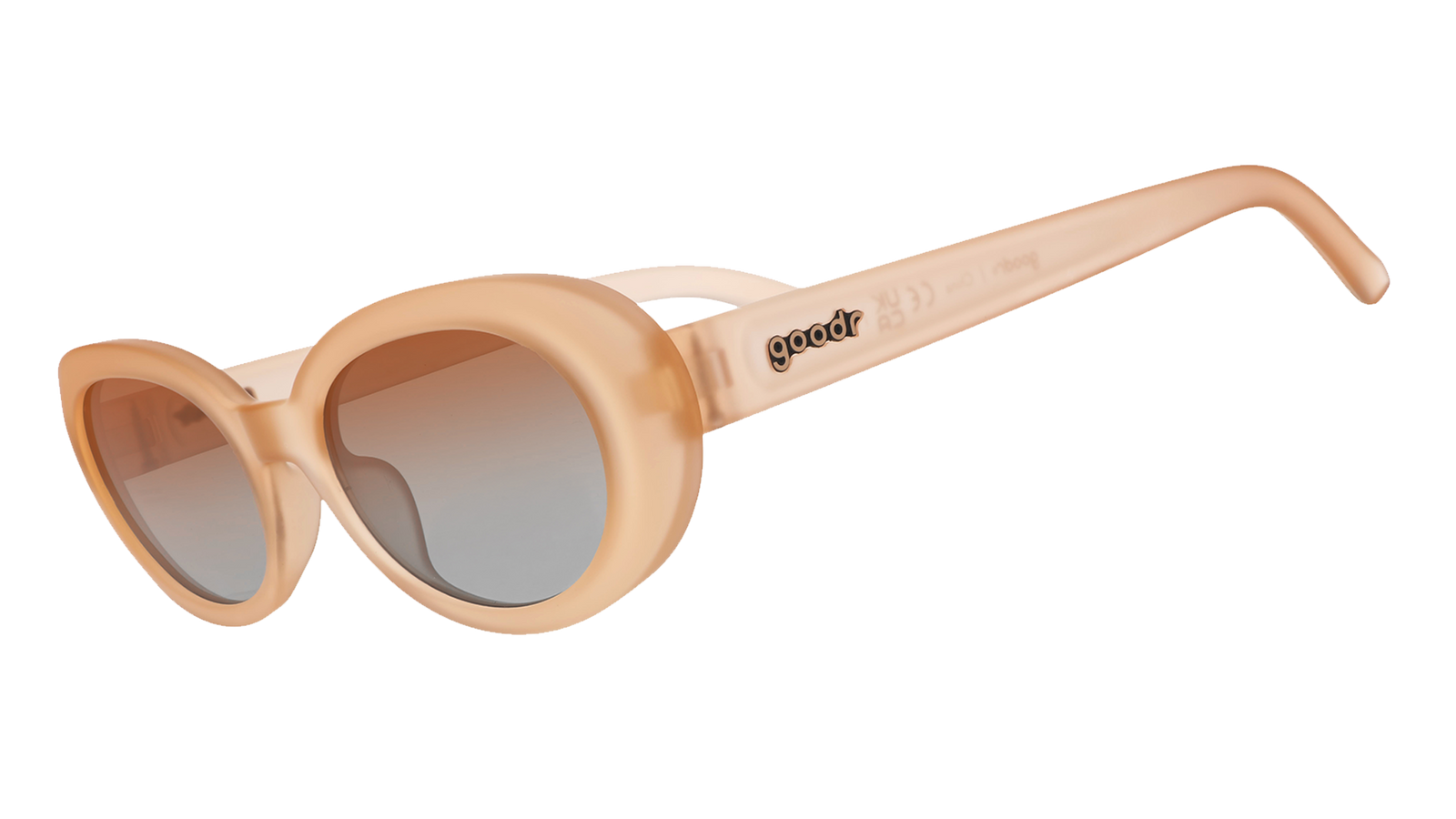 Three-quarter angle view of translucent pale peach oval Beat G sunglasses with orange-gold gradient lenses. 