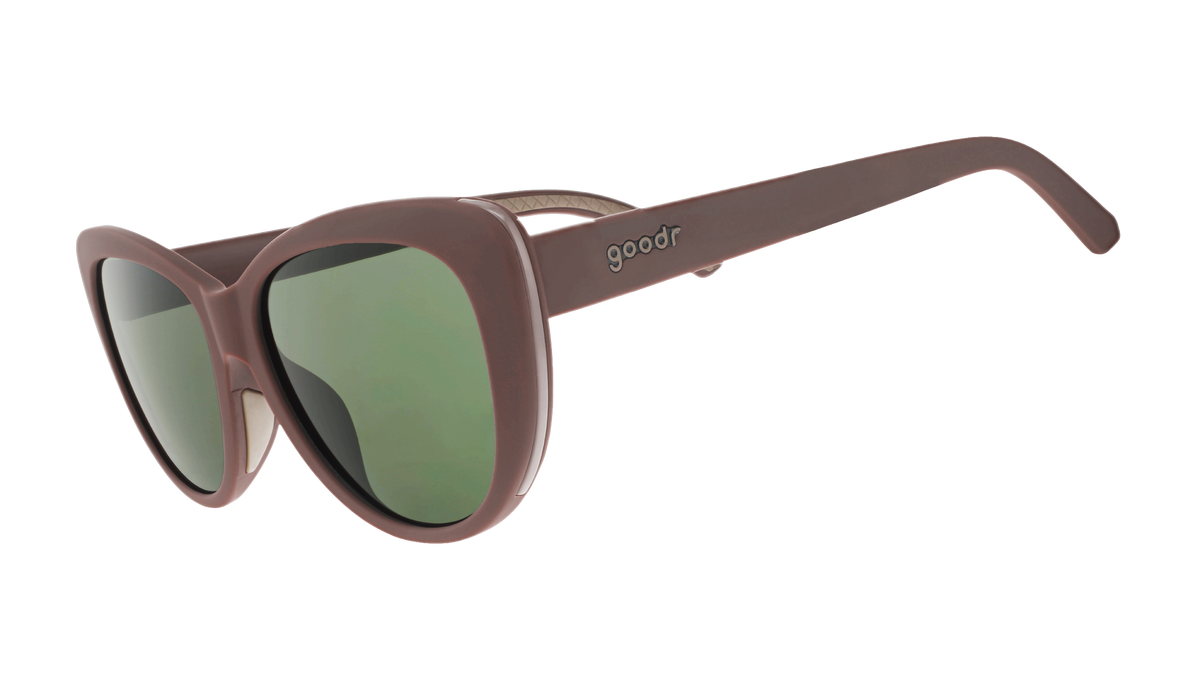 Three-quarter-angle view of opaque brown Glam G cat-eye  sunglasses with green non-reflective lenses.