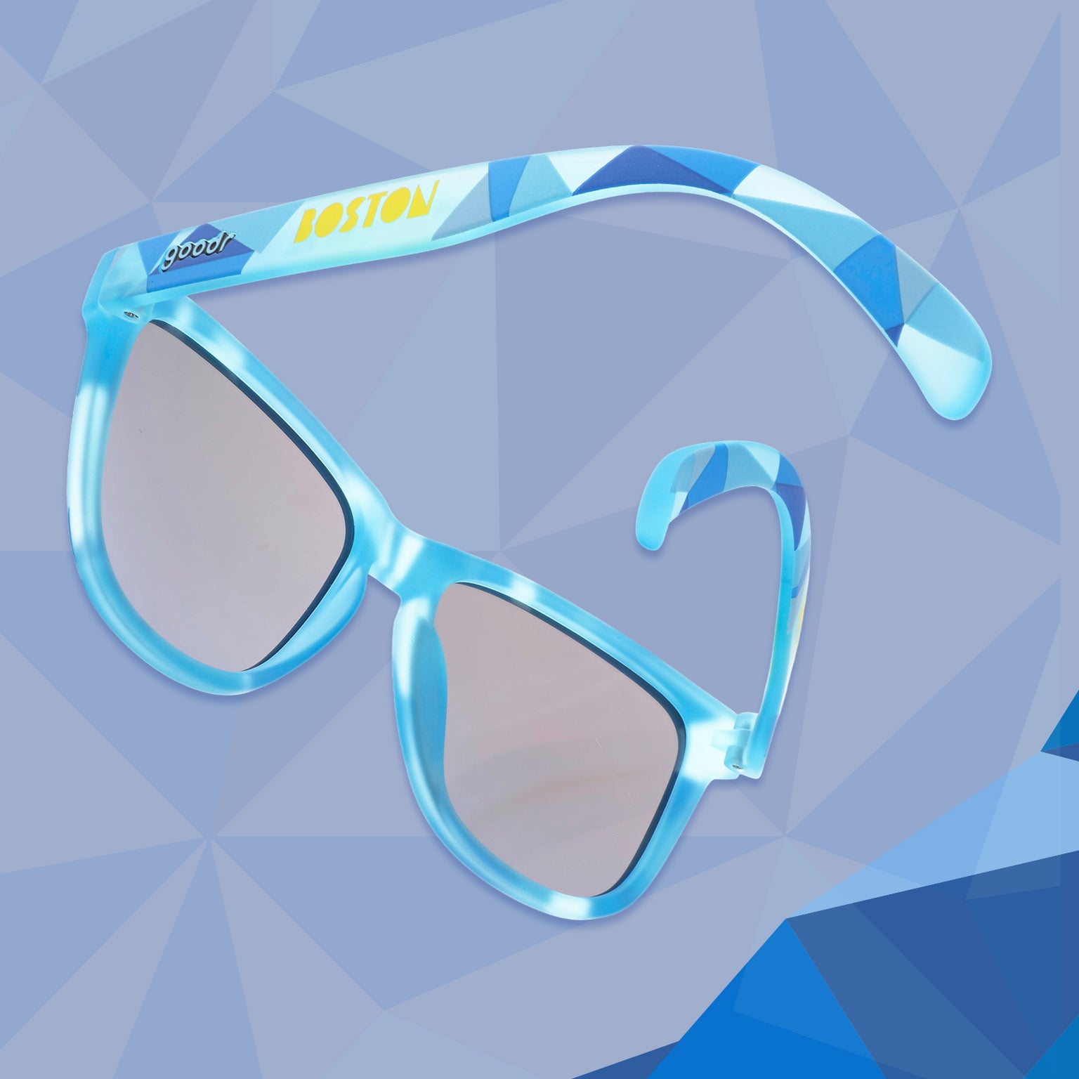 Front view of light blue sunglasses w/ a geometric pattern on a white background. Blue reflective lenses.