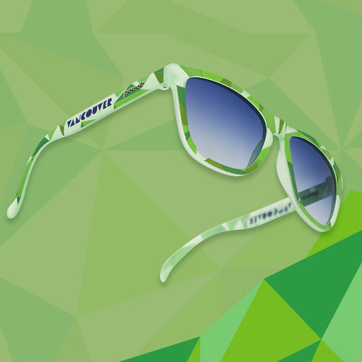 Three-quarter angle view of light green shades w/ geometric pattern, Vancouver printed on temples+blue gradient lenses.