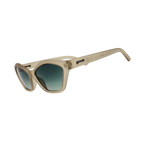 Beige sunglasses with dark lenses on a white background