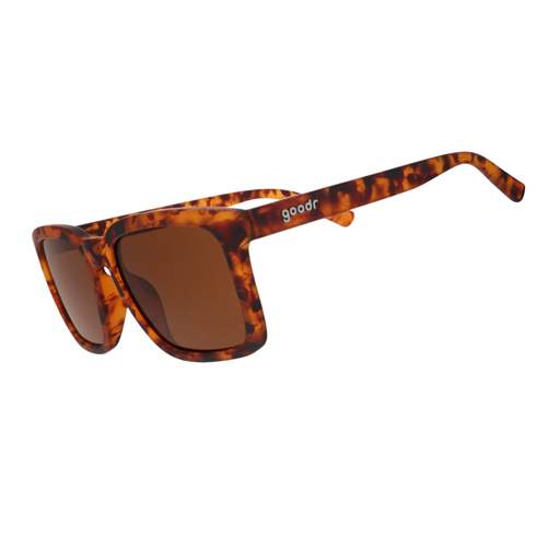 Angled view of translucent brown square sunglasses w/ a tortoiseshell pattern & brown nonreflective lenses tilted down.