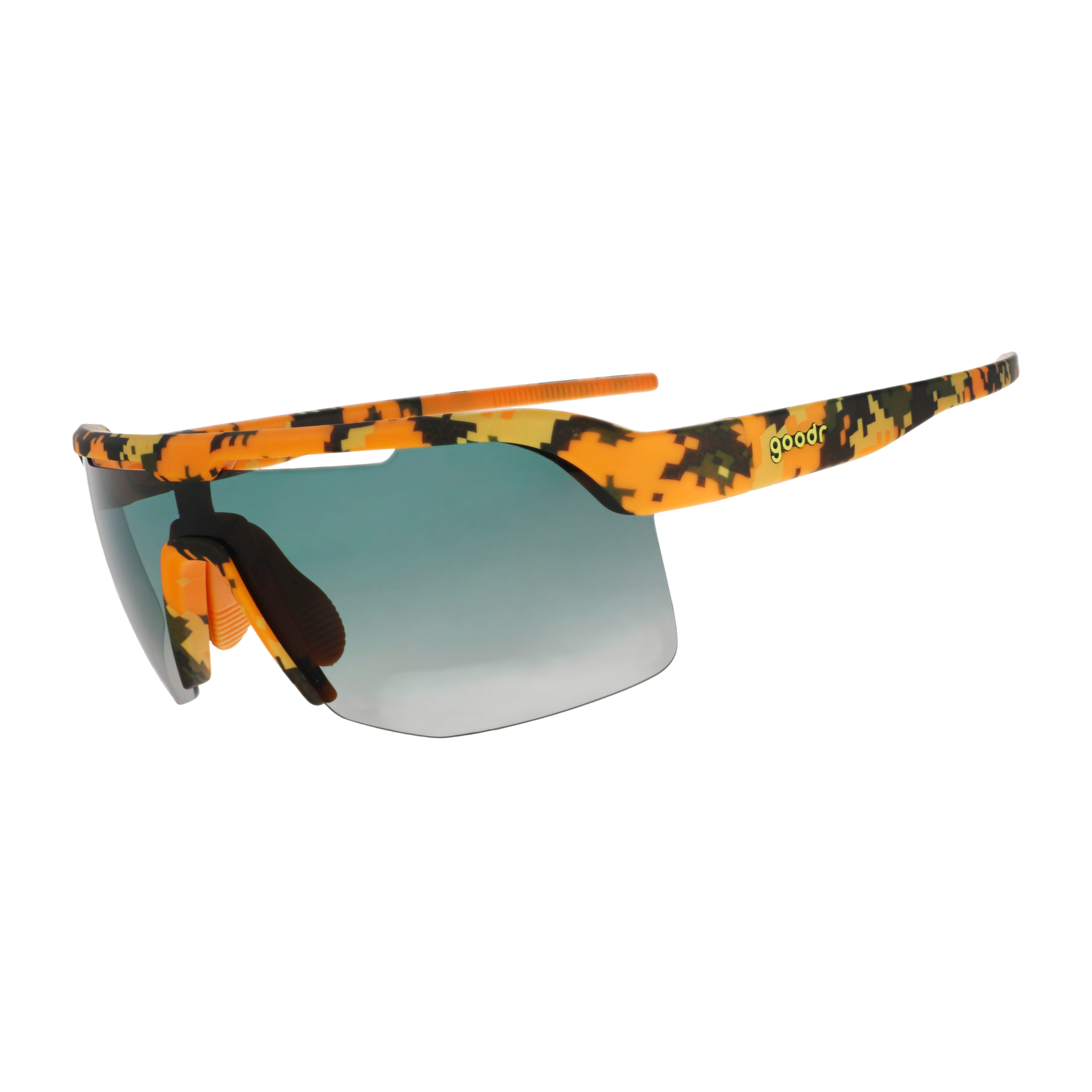 Sport sunglasses with a vibrant orange, yellow, and black camouflage pattern on the frame and arms, featuring a blue-to-gray gradient lens and a small green 'goodr' text logo on the temple.