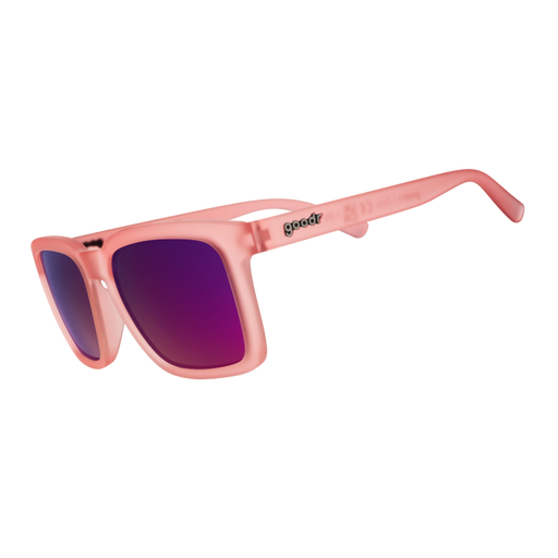 Angled view of translucent light pink shades with pink reflective lenses and a classic square silhouette tilted down.